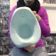 An Eastern-European girl with red hair takes a piss and a shit while sitting on a plastic baby potty. No product or poop action is visible, but we can hear a thump and see her dirty toilet paper as she wipes. Exactly 5 minutes.